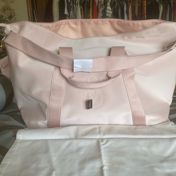 Victoria's Secret Handbags - Victoria's Secret Blush Pink Travel Duffel with Embossed VS Logo
